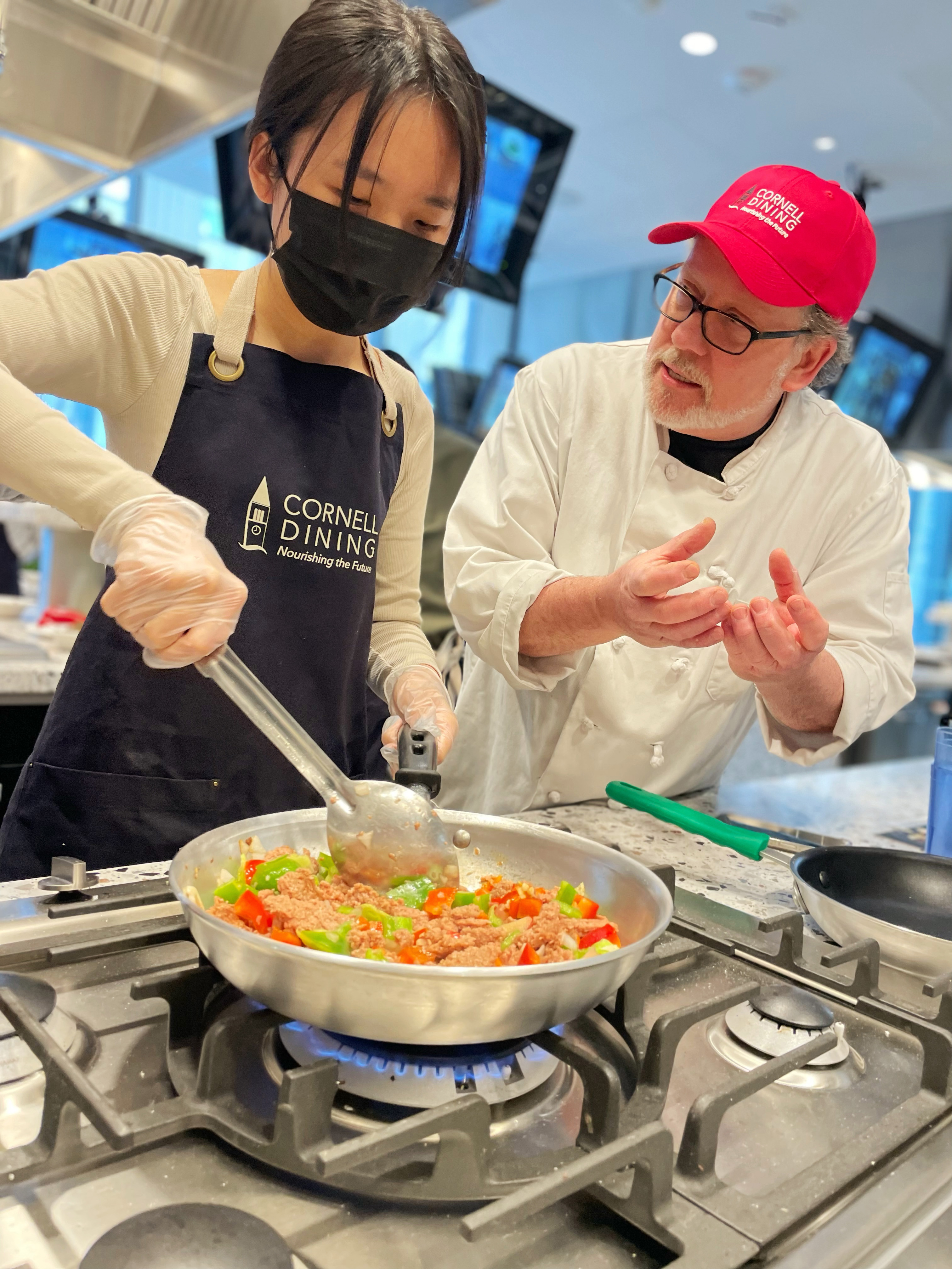 A student learns to make plant-based tacos during a “Get Cooking” class with Chef Paul Zullo.
