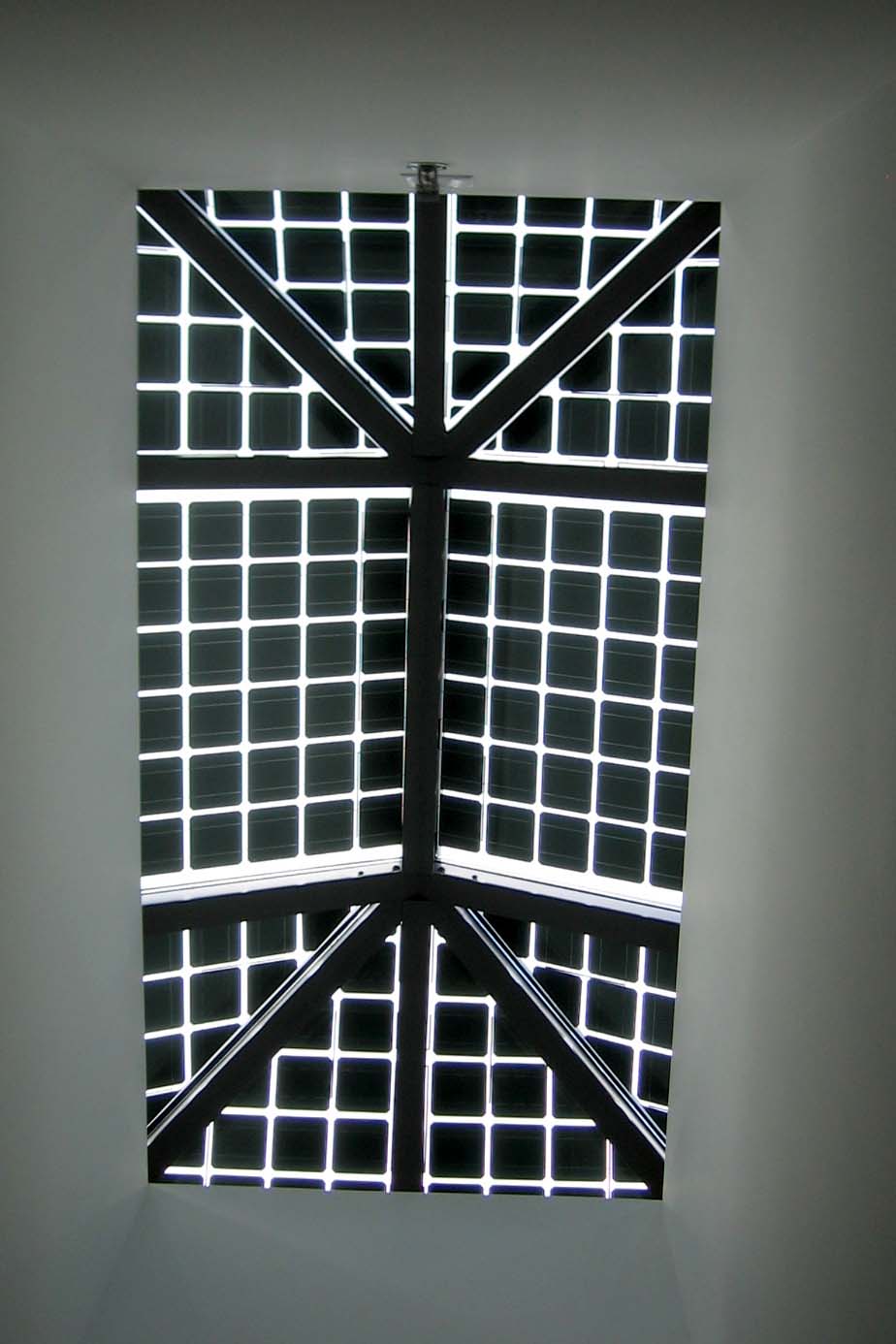Inside view looking up at the photovoltaic glass skylights in the atrium of Fernow Hall.