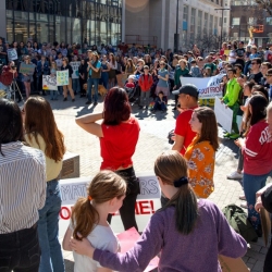 People gather on the commons to rally against climate change