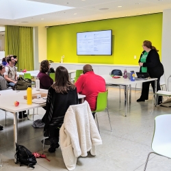 Staff watch a presentation on green team practices