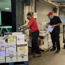 Bob Bushey from PFG and Eric Moyer from Cornell Dining unload a food delivery for North Star Dining Room at the Appel Commons loading dock.