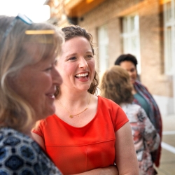 Employees laughing together at awards ceremony