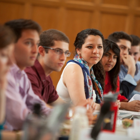 students sitting around a table at student assembly meeting