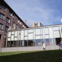 Students walk past Cook House on west campus.