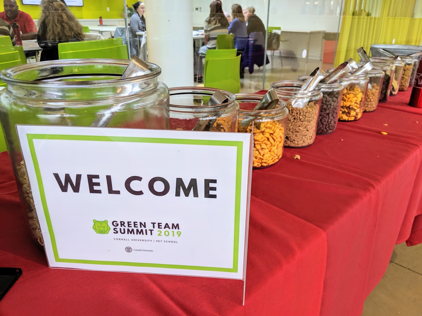 Welcome sign in front of jars of food